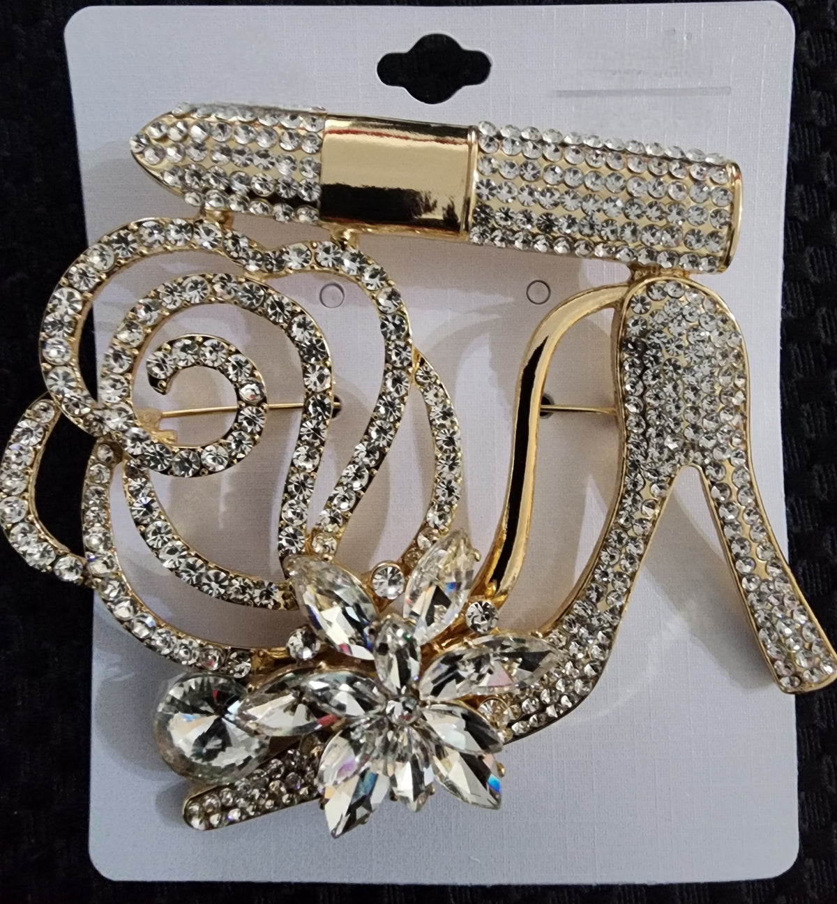 gold heel brooch