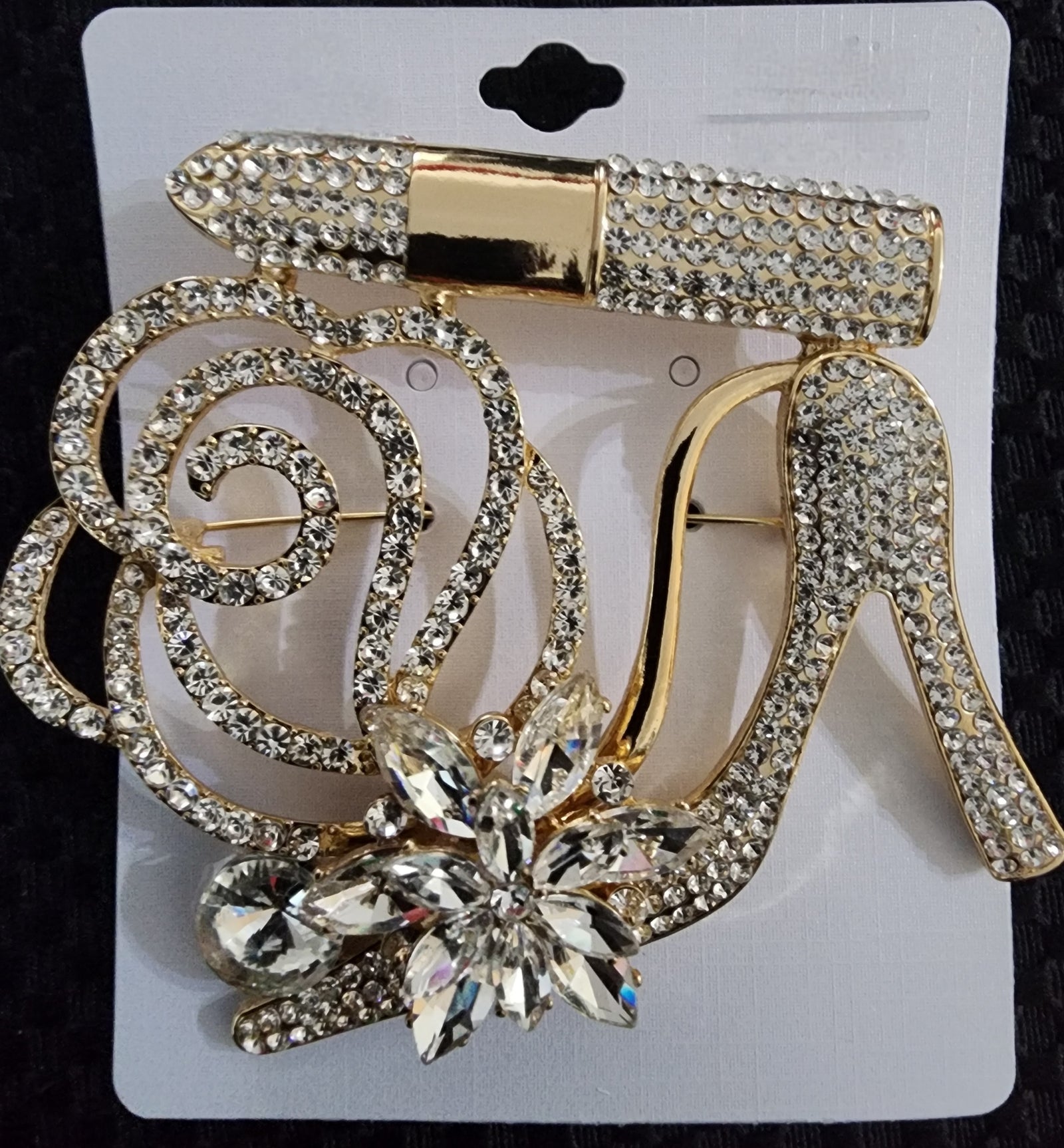 gold heel brooch
