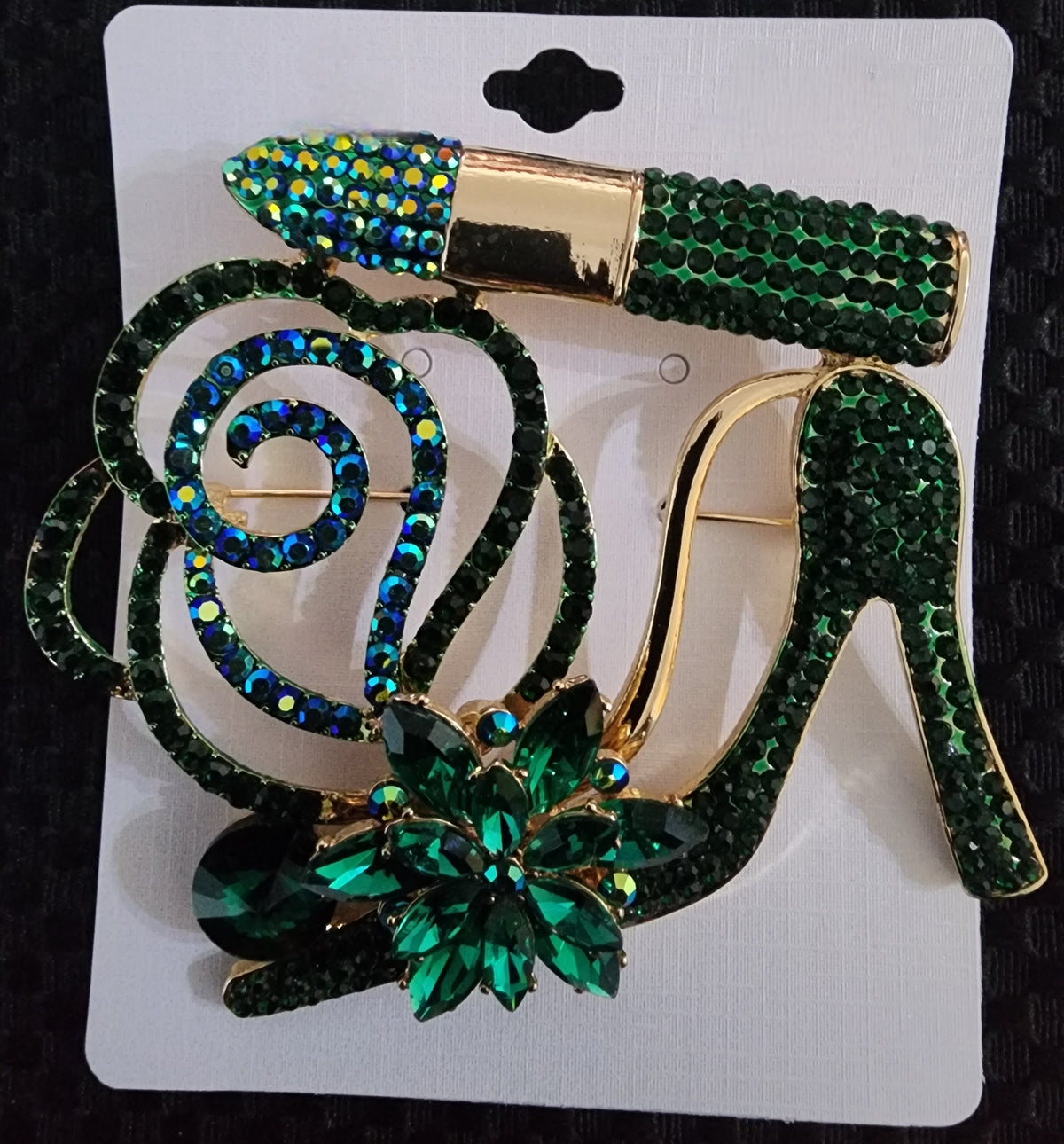 green heel brooch