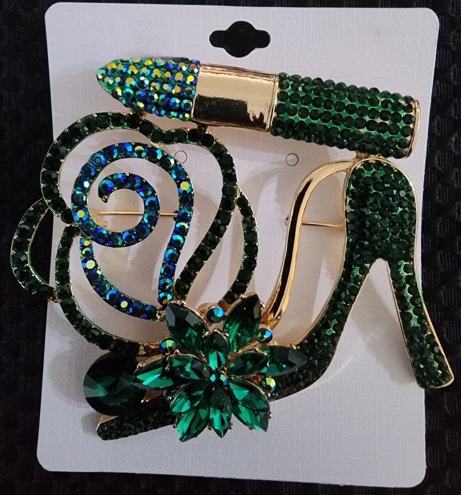 green heel brooch