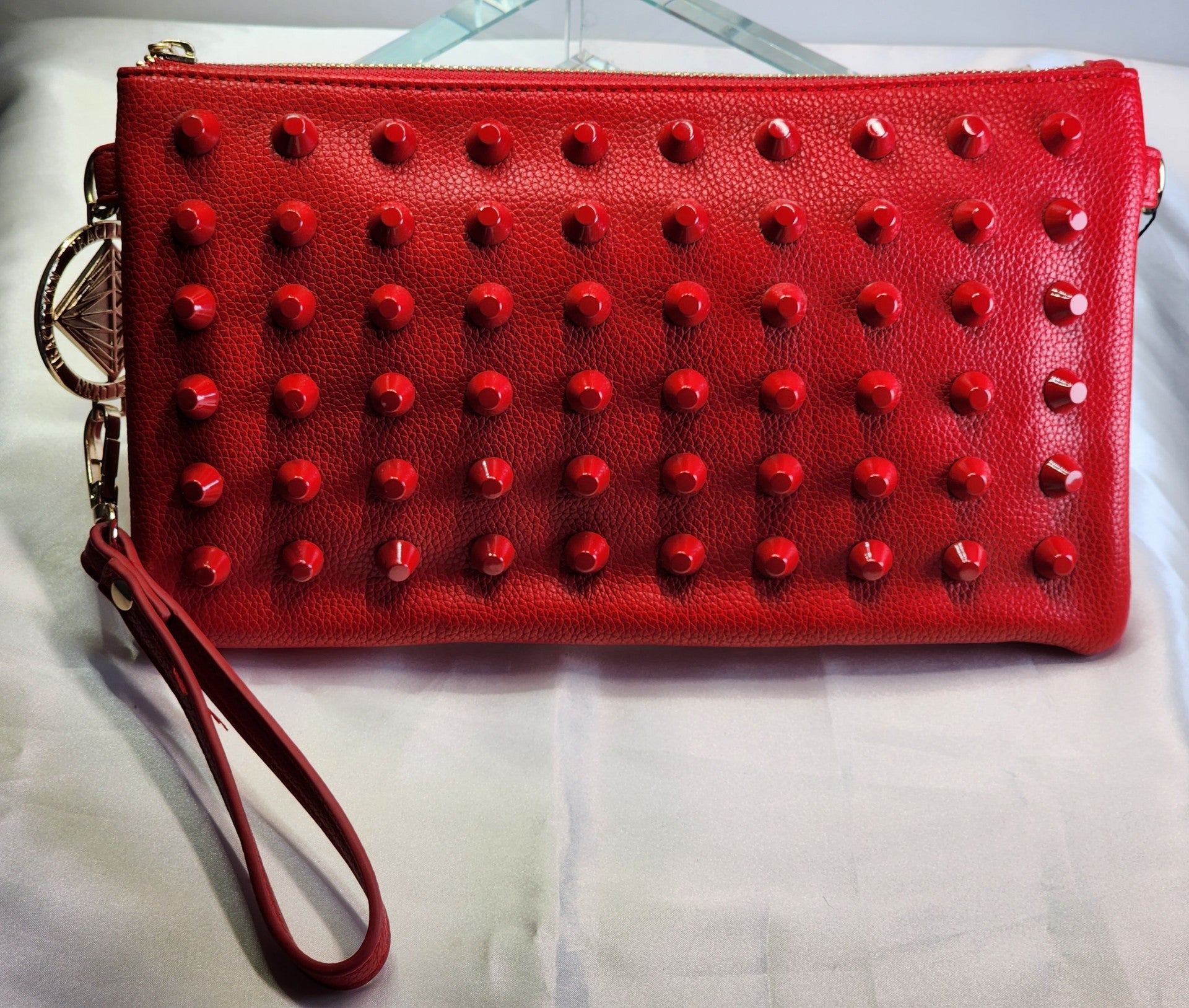 Red studded clutch