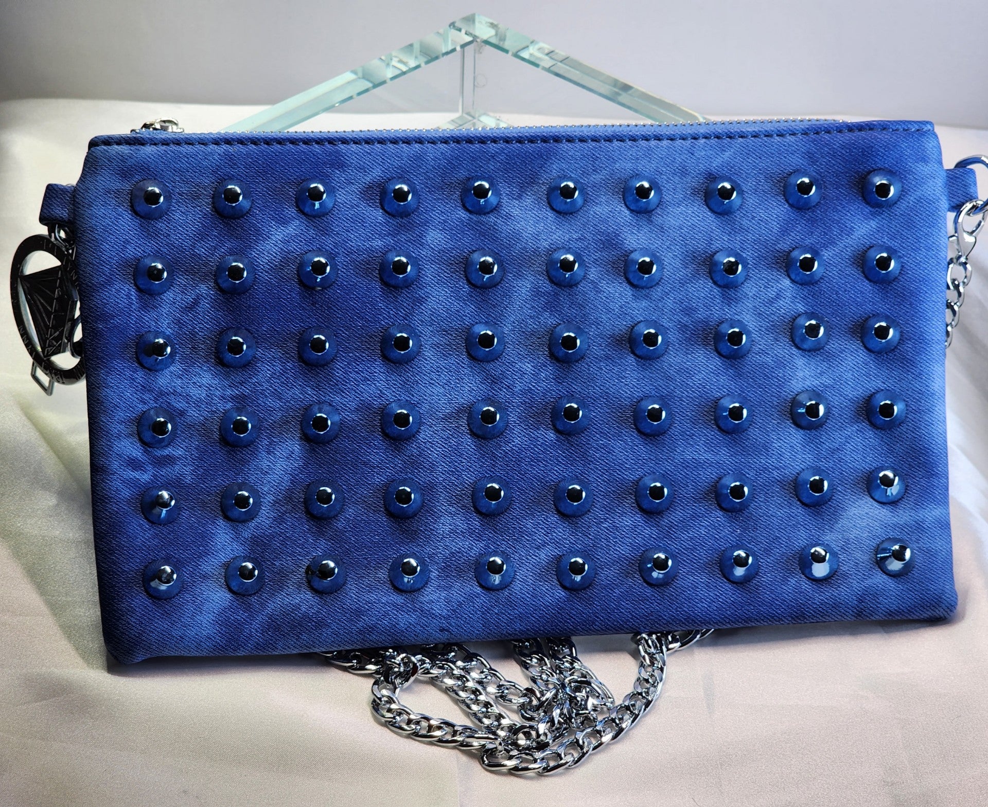 Denim studded clutch