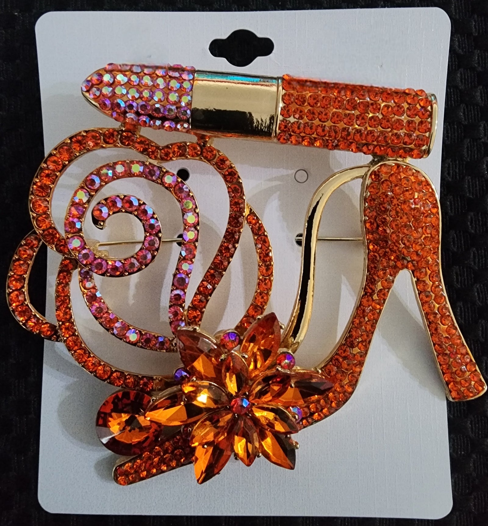 orange heel brooch